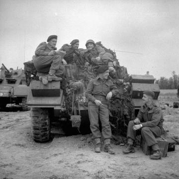 Piled on a Sherman Tank